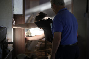 Ángeles Santos de Pedro and her father Alonso, working together in a covered area