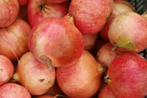 Close-up of a box of freshly harvested pomegranates