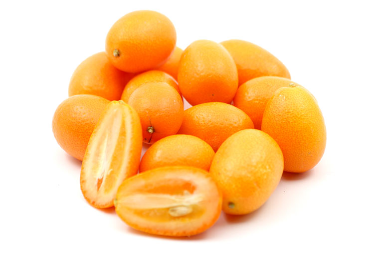 Photograph of whole and cut kumquats