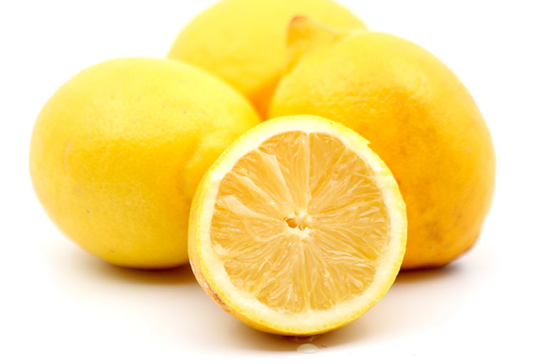 Whole and cut lemons