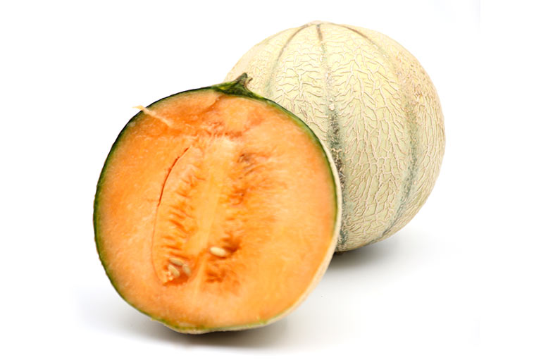 Two cantaloupe melons, one of them cut in half and showing the inside