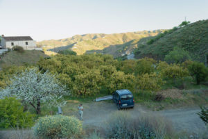 A car parked outside the farm of La Perucha