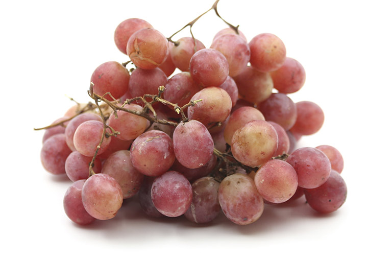 A bunch of light red table grapes