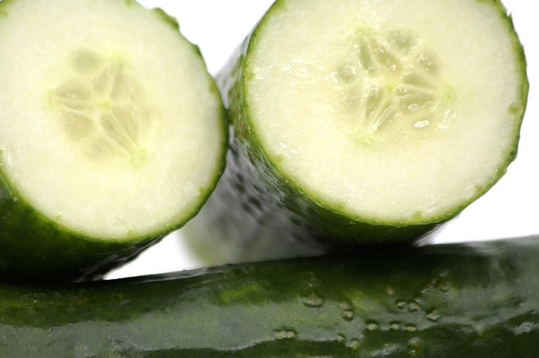 Close up of a cut cucumber, showing the thin skin and seedless centre
